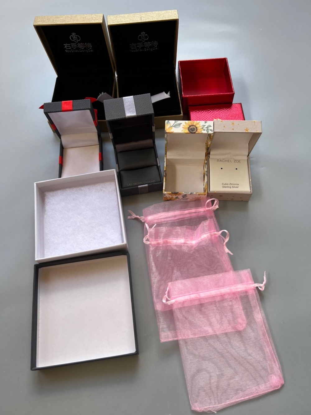 Assorted Jewelry Boxes and Pink Organza Bags